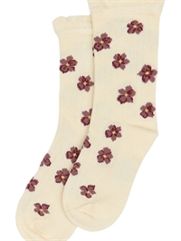 Minipop strømper i off-white med blomsterprint i bordeaux og gult set forfra